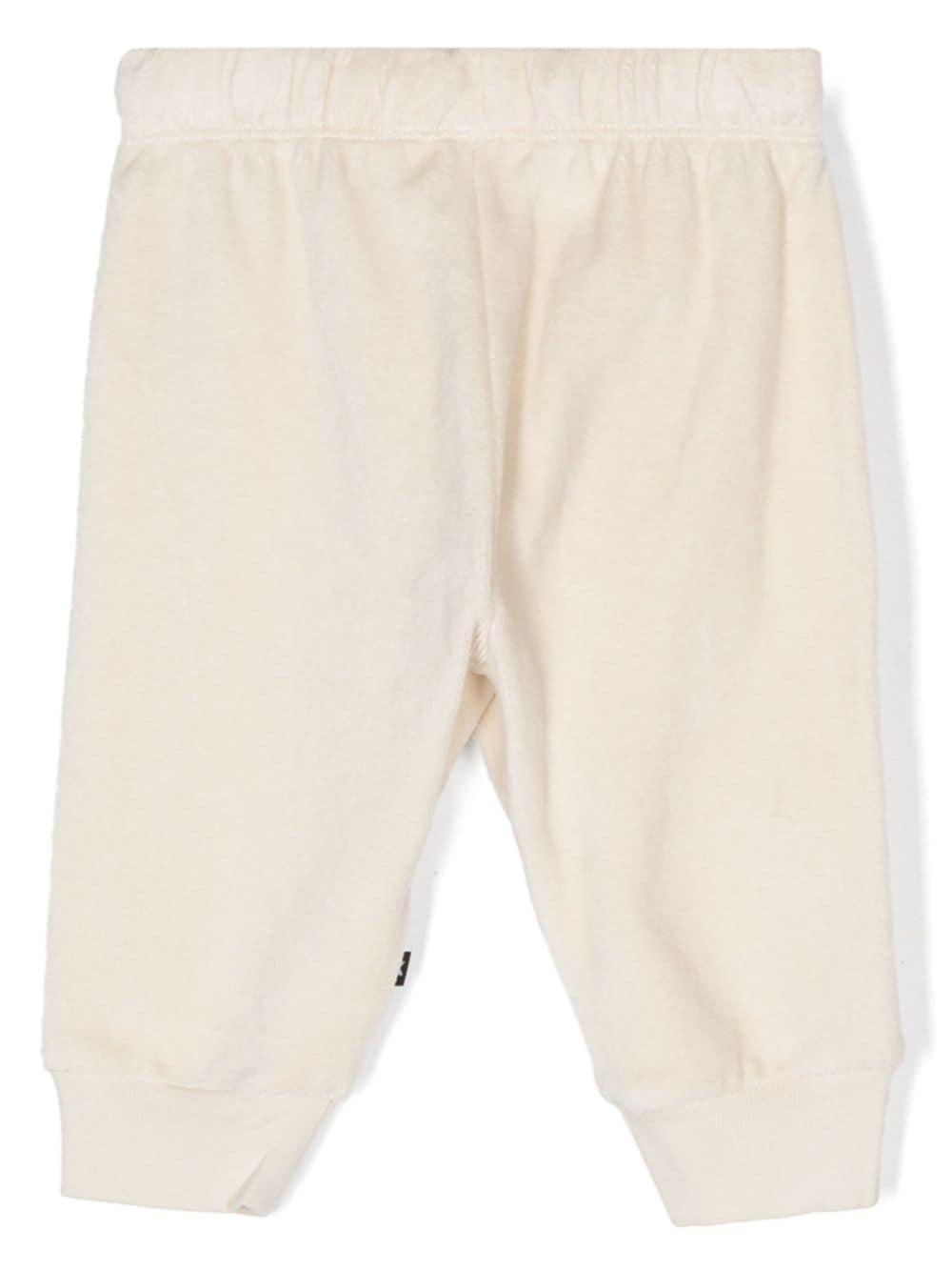 Pantaloni sportivi per neonato Molo Sigo bianco in velluto 6W24I223 8955 MOLO 