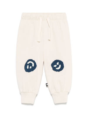 Pantaloni sportivi per neonato Molo Simeon beige con motivo smiley