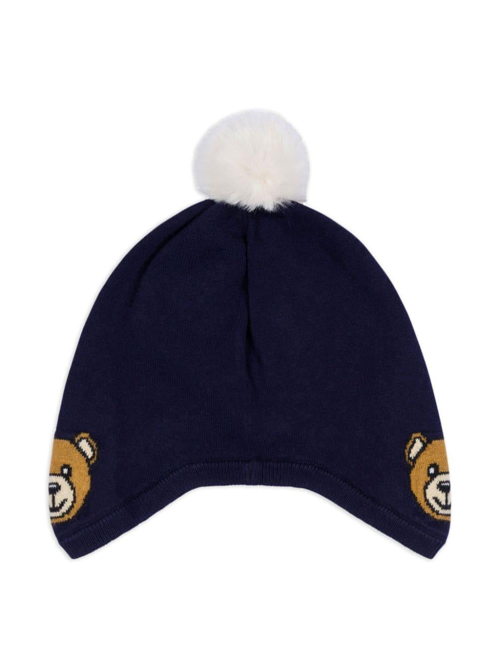 Berretto con pompon per neonato Moschino Kids blu con lavorazione a maglia MUX04ZLHE66 40016 MOSCHINO KIDS 