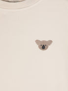 T-shirt per neonata Donsje Jarne beige con ricamo sul petto 4081802 00133 DONSJE 