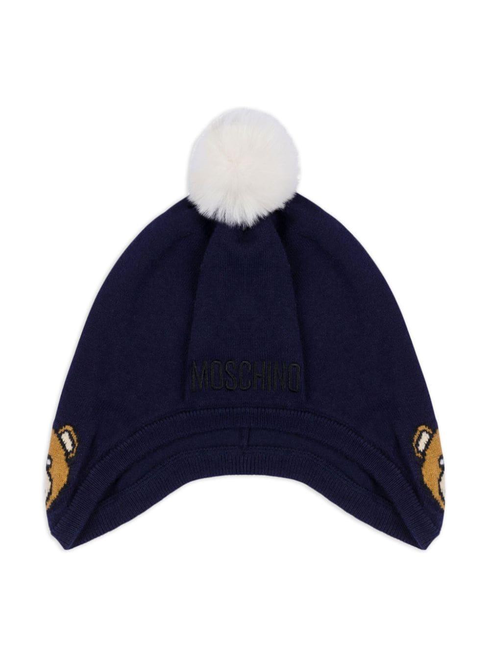 Berretto con pompon per neonato Moschino Kids blu con lavorazione a maglia MUX04ZLHE66 40016 MOSCHINO KIDS 