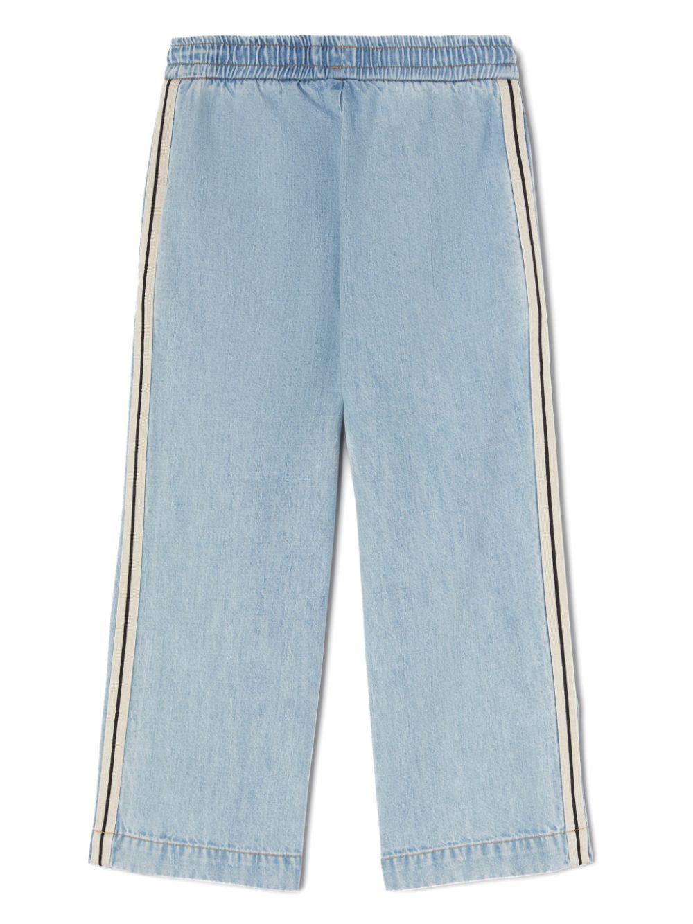Pantaloni sportivi con logo per bambino Palm Angels Kids blu con dettaglio a righe PBYB006S25DEN001 4545 PALM ANGELS KIDS 