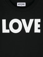 T shirt nera per bambina Moschino con stampa LOVE bianca HDV0FULCA61 60100 MOSCHINO KIDS 
