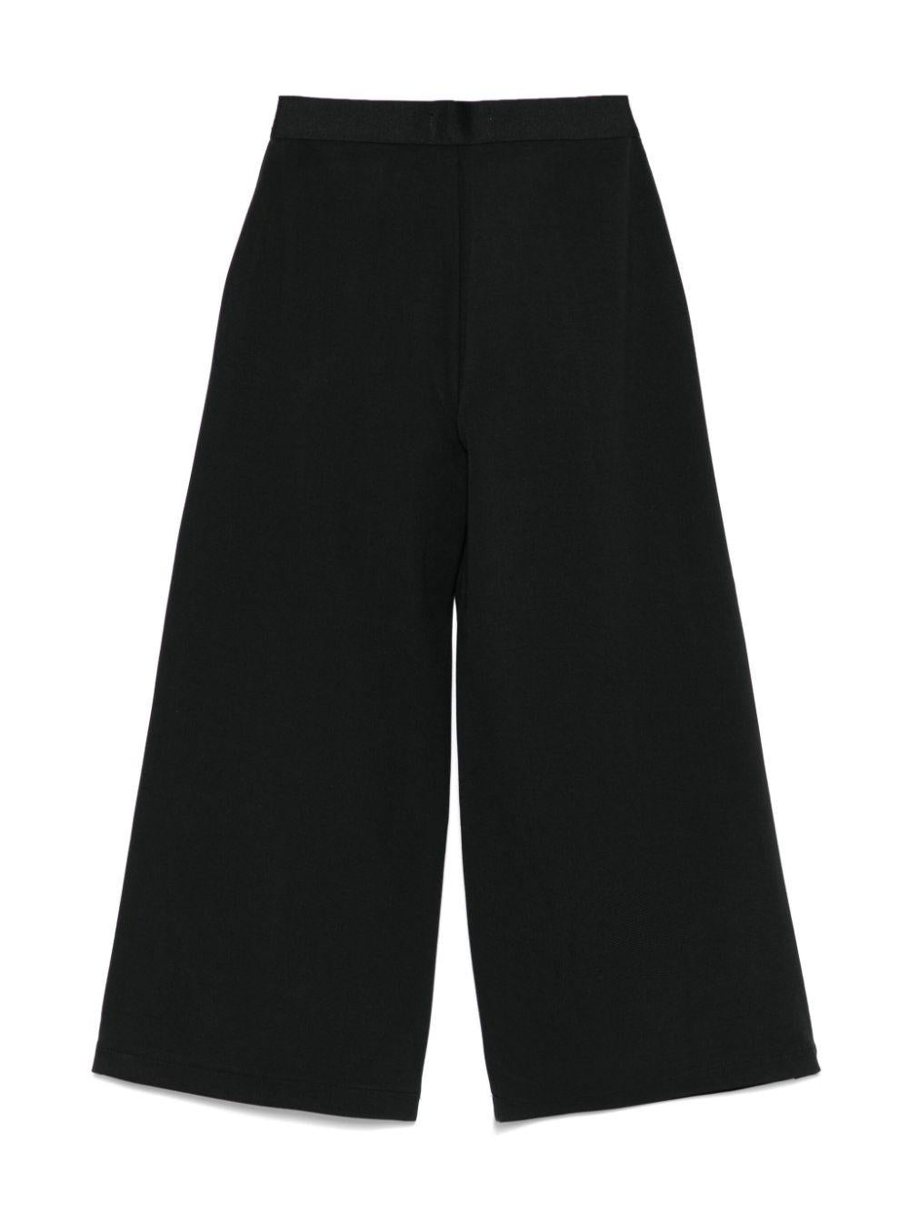 Pantaloni con banda logo per bambina Calvin Klein Kids nero con dettagli plissettati IG0IG02780 BEH CALVIN KLEIN KIDS 