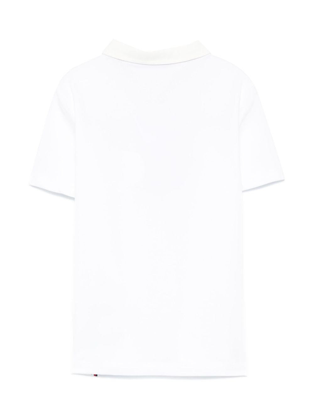 Polo con ricamo per bambino Tommy Hilfiger Junior bianco con spacchi laterali KB0KB09332 YBR TOMMY HILFIGER JUNIOR 