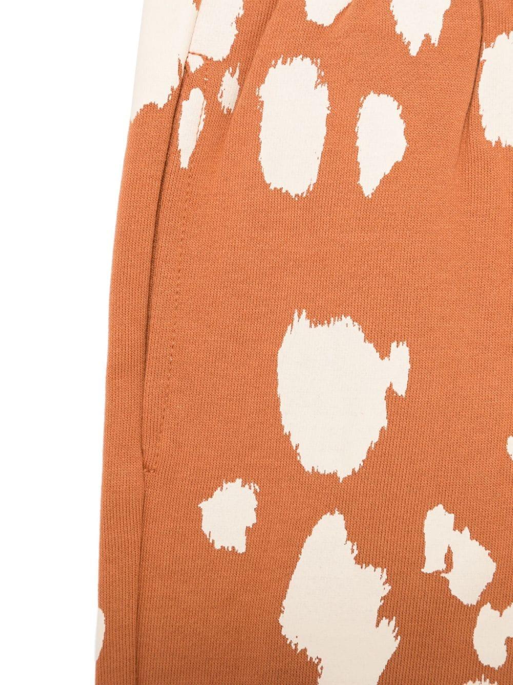 Pantaloni sportivi arancioni per bambina con stampa all over Stella McCartney Kids TV6Q70 Z2161 317BG STELLA McCARTNEY KIDS 