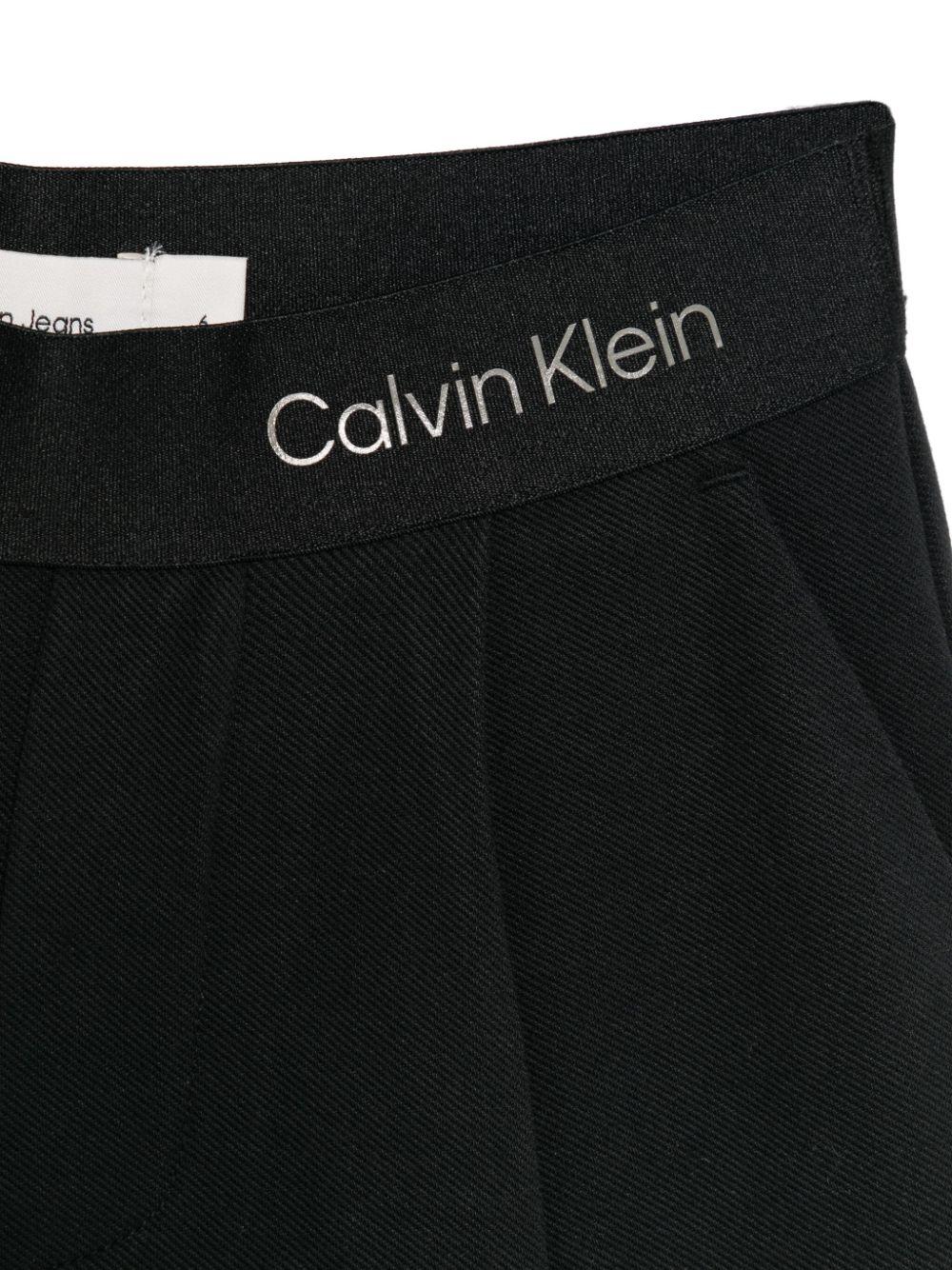 Pantaloni con banda logo per bambina Calvin Klein Kids nero con dettagli plissettati IG0IG02780 BEH CALVIN KLEIN KIDS 