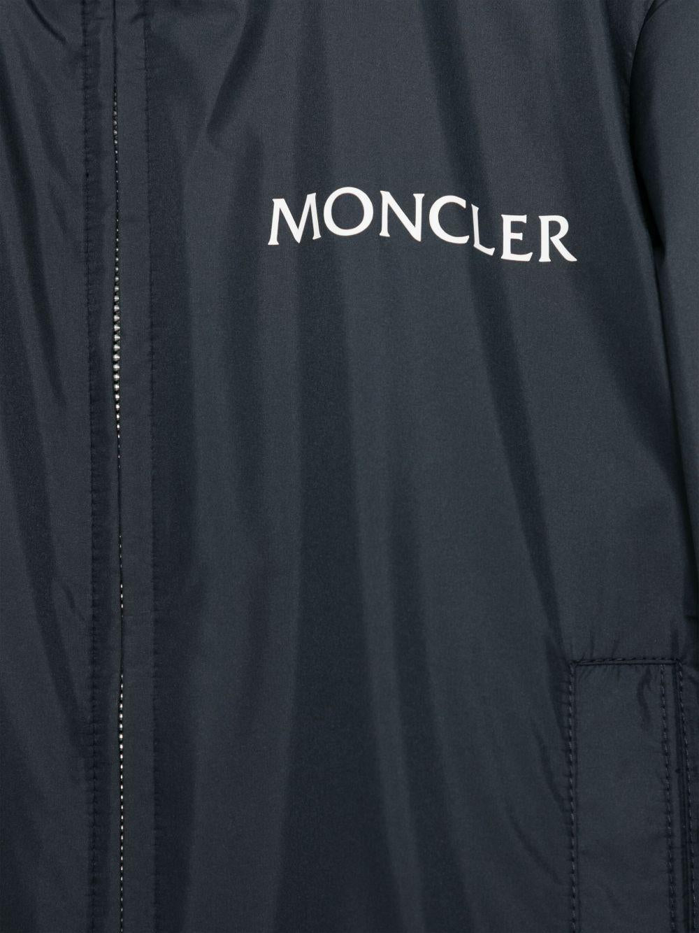 Giubbino Warne per bambino Moncler Enfant blu con cappuccio nascosto K19541A00040597X2 77G MONCLER ENFANT 