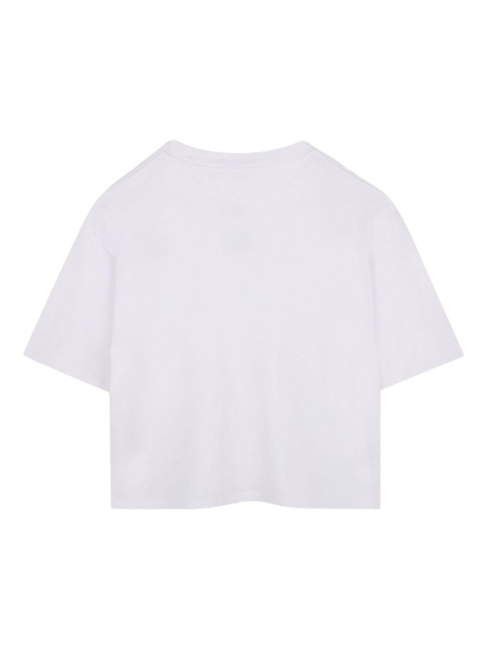 T-shirt per bambina DKNY Kids bianco con scollo a V D62411 10P DKNY 
