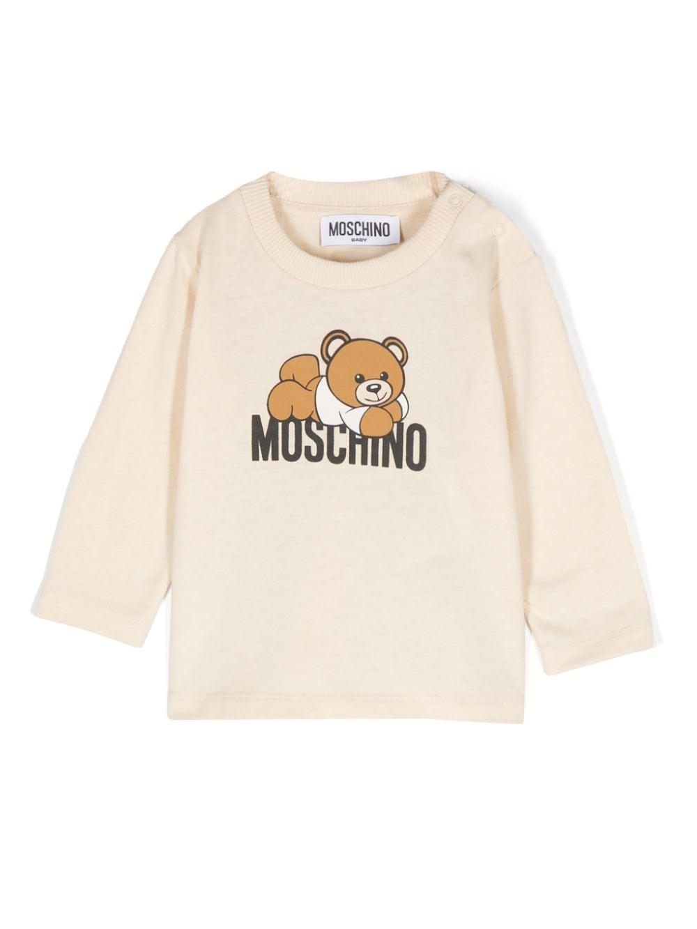 T-shirt per neonati Moschino Kids beige a maniche lunghe con stampa logo MOO00RLAA36 20404 MOSCHINO KIDS 