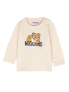 T-shirt per neonati Moschino Kids beige a maniche lunghe con stampa logo MOO00RLAA36 20404 MOSCHINO KIDS 