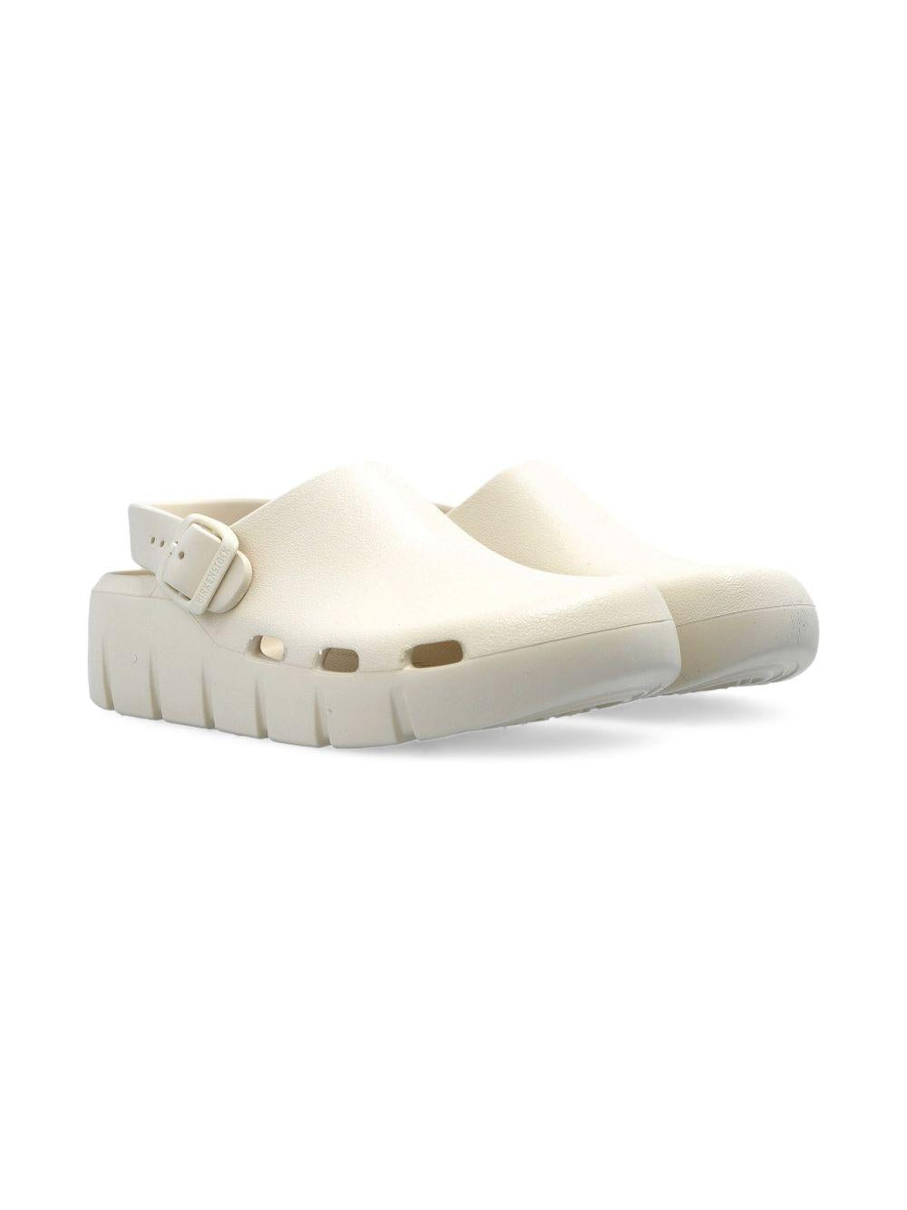 Sandali per bambini Birkenstock Kids Birki Flow beige con cinturino alla caviglia 1029567 EGGSHELL BIRKENSTOCK 