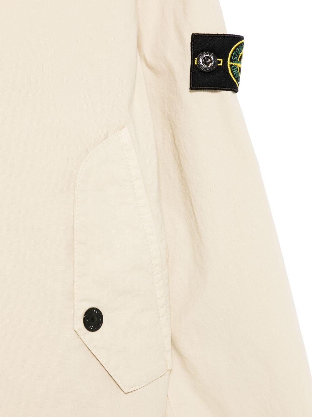 Giacca per bambino Stone Island Junior beige con applicazione Compass K1S164100004S0001 V0095 STONE ISLAND JUNIOR 
