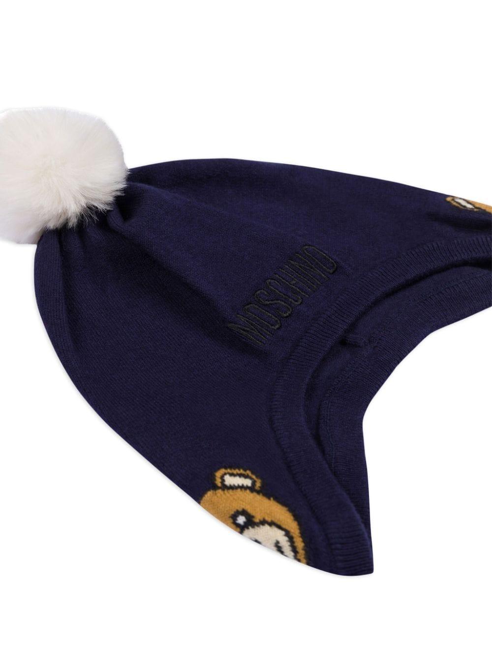 Berretto con pompon per neonato Moschino Kids blu con lavorazione a maglia MUX04ZLHE66 40016 MOSCHINO KIDS 
