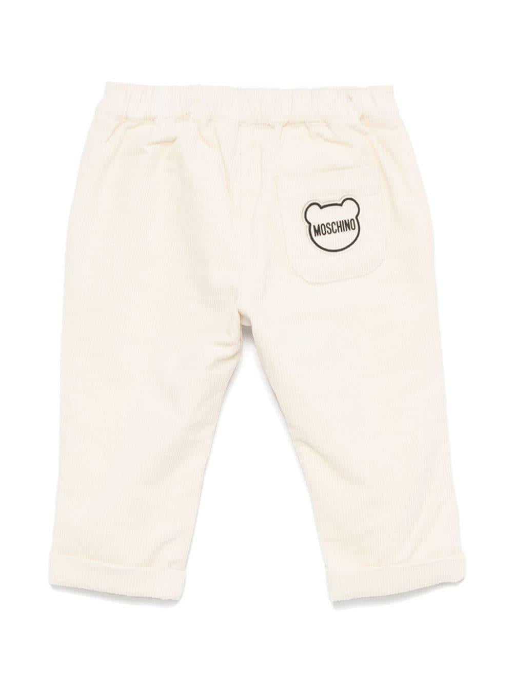 Pantaloni per neonato Moschino Kids beige chiaro a coste con logo sul retro MDP038LVA05 20404 MOSCHINO KIDS 