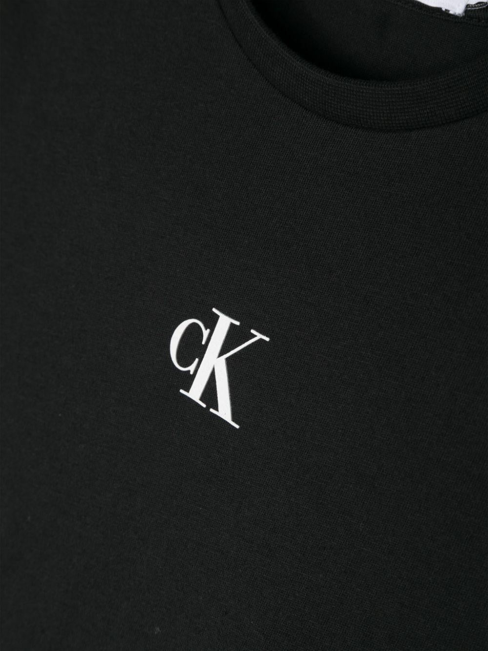 T-shirt con stampa per bambina Calvin Klein Kids nero con scollo rotondo IG0IG02136 BEH CALVIN KLEIN KIDS 
