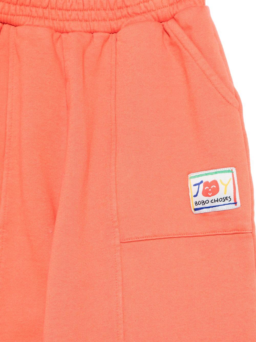 Pantaloni sportivi per bambina Bobo Choses Smiling arancione con vita elasticizzata B125AC078 611 BOBO CHOSES 