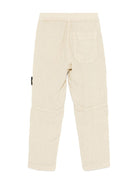 Pantaloni per bambino Stone Island Junior beige con applicazione Compass K1S163100002S0145 V0095 STONE ISLAND JUNIOR 