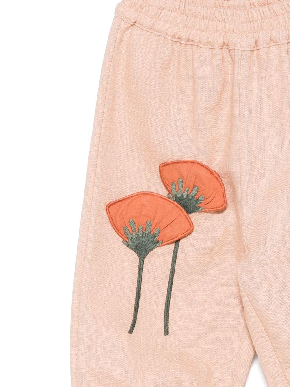 Pantaloni per neonata Donsje Anje rosa con applicazione a fiori 3035801 00108 DONSJE 