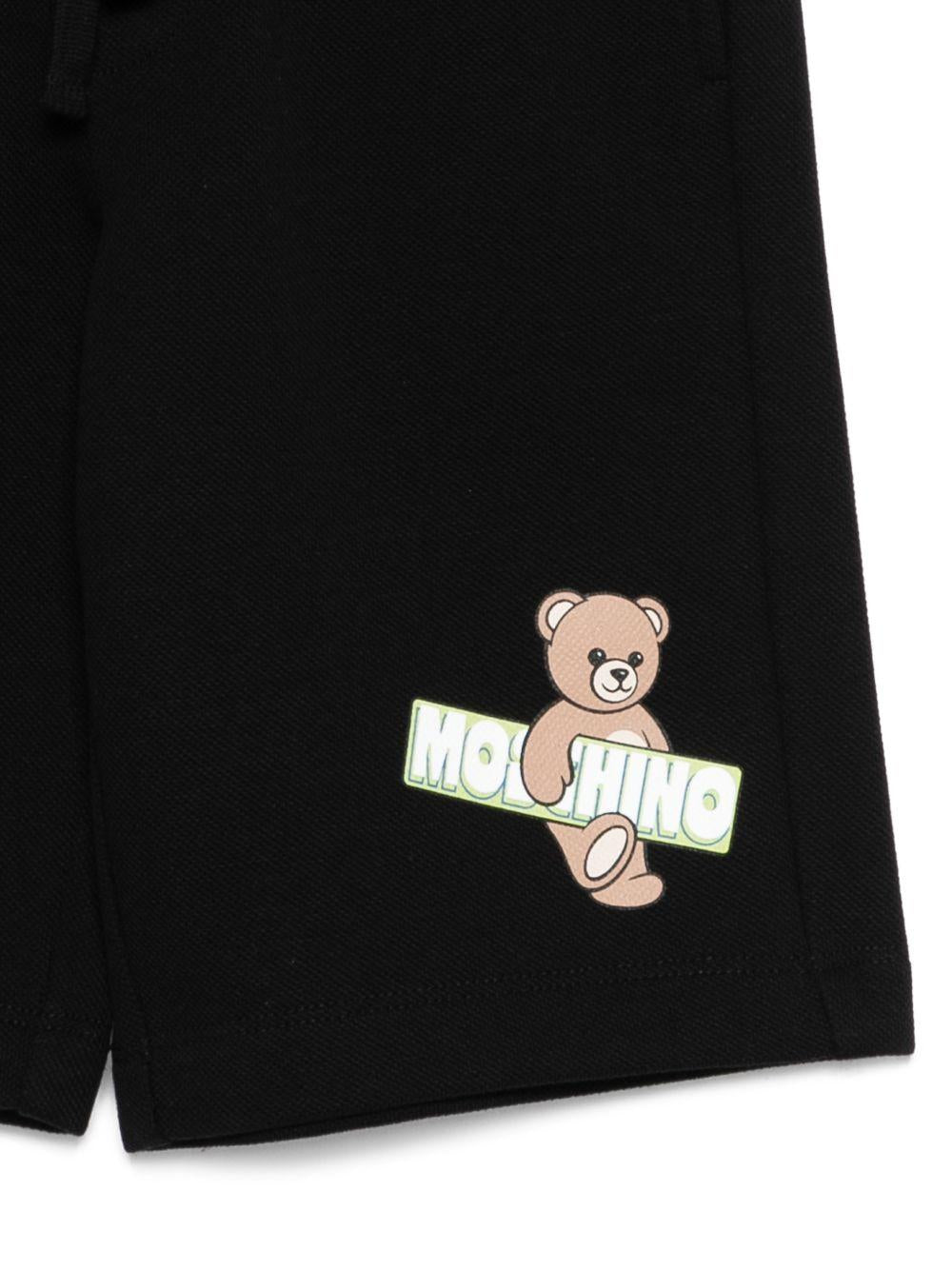 Shorts per bambino Moschino Kids neri con logo sul davanti HUQ02LLCA90 60100 MOSCHINO KIDS 