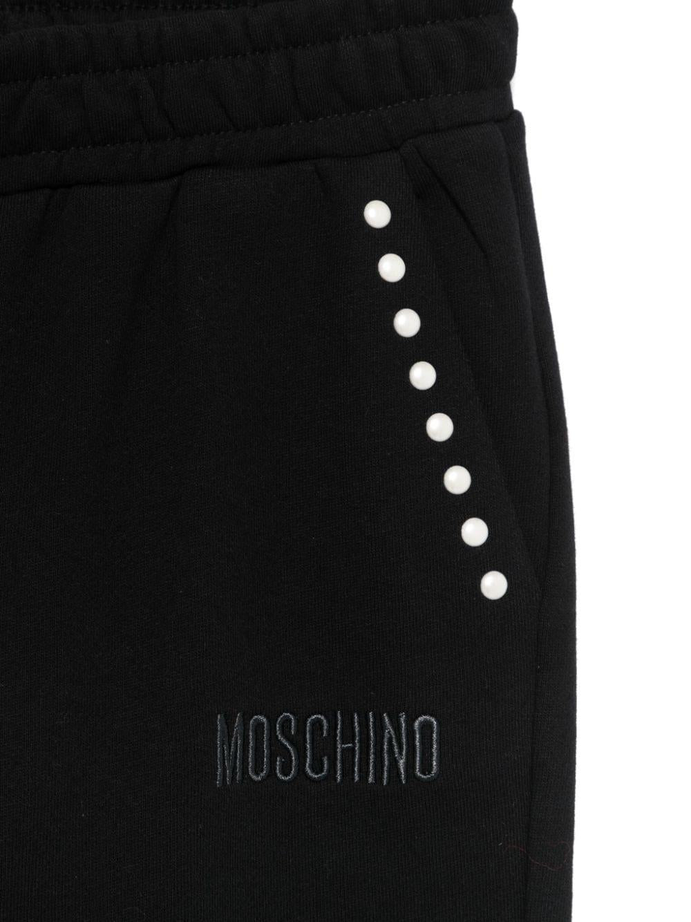 Pantaloni sportivi con borchie per bambina Moschino Kids neri con dettaglio borchiato HDP06ALCA23 60100 MOSCHINO KIDS 