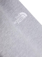 Pantaloni grigi per bambino sportivi effetto mélange con ricamo The North Face Kids NF0A89HU DYX1 THE NORTH FACE 