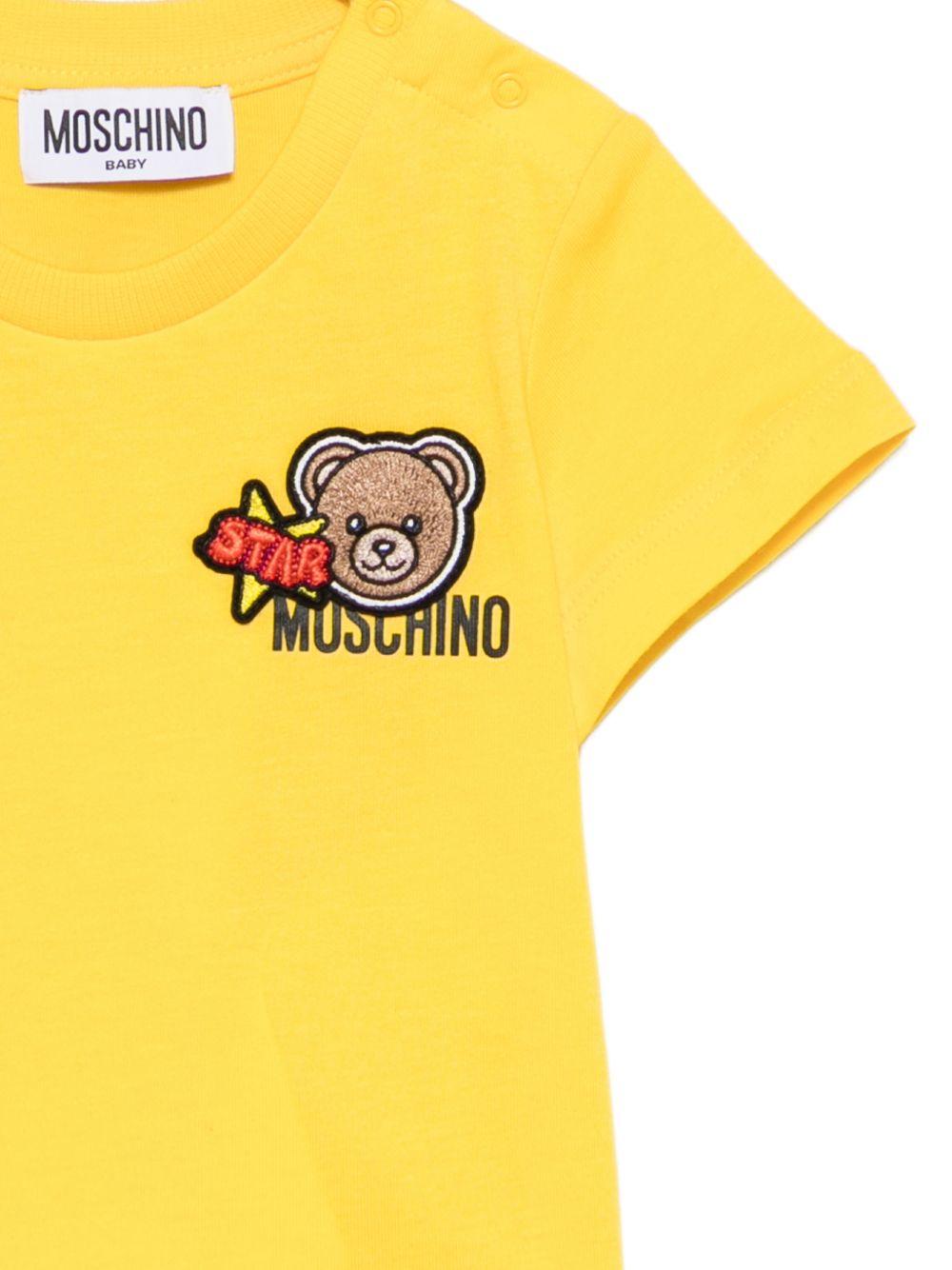 T-shirt per neonati Moschino Kids gialla con Teddy Bear ricamato MVM047LAA24 50577 MOSCHINO KIDS 