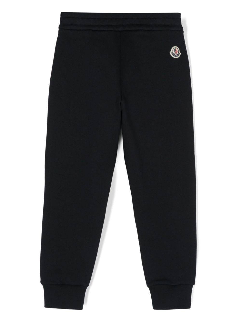 Pantaloni da tuta con stampa logo per bambino Moncler Enfant blu con toppa J29548H00005 899PS 778 MONCLER ENFANT 