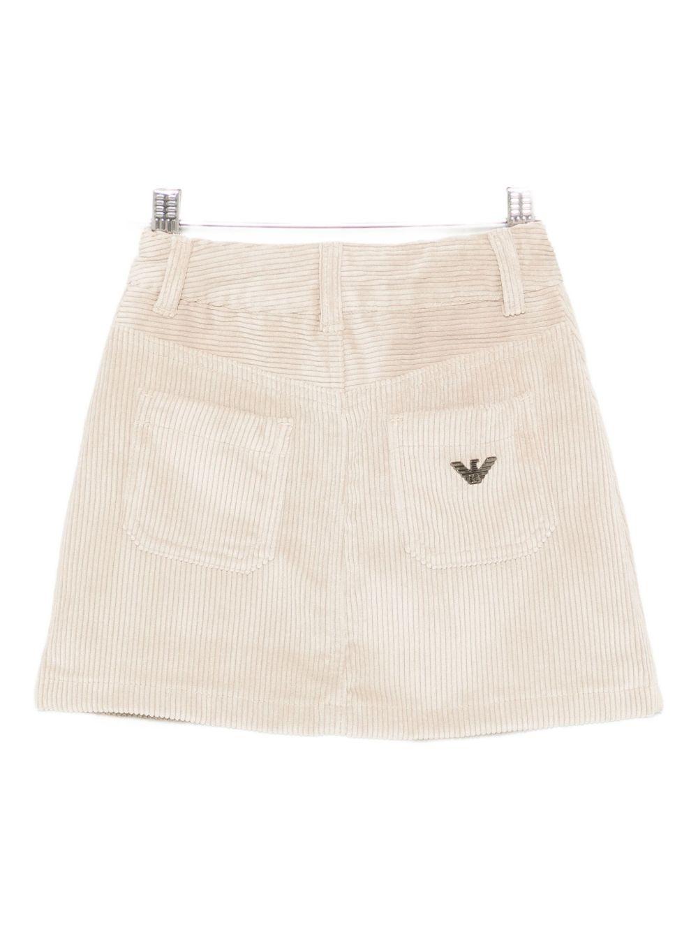 Gonna per bambina Emporio Armani Kids beige con placchetta logo aquila EG000396 AF16697 U6281 EMPORIO ARMANI KIDS 