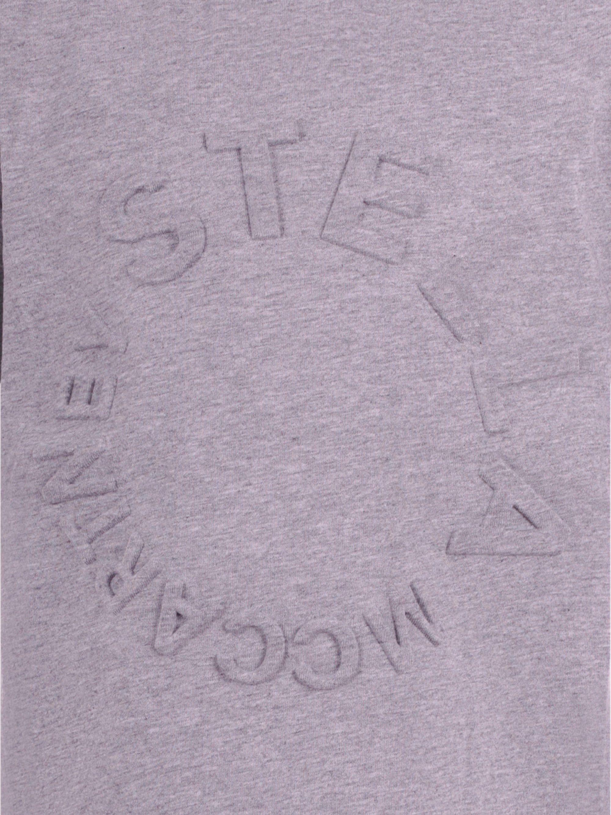 T-shirt per bambina Stella McCartney Kids grigia con logo goffrato sul davanti TV8P41 Z0434 809 STELLA McCARTNEY KIDS 