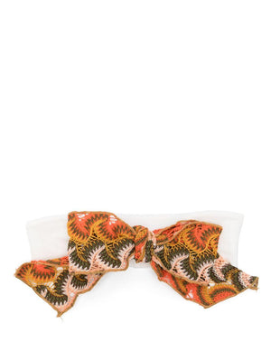 La Stupenderia white baby headband with bow and internal logo application