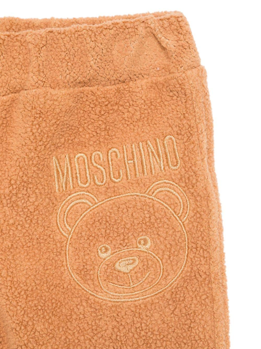 Tuta sportiva per neonato Moschino Kids beige con logo sul petto MUK04TLIA21 20121 MOSCHINO KIDS 