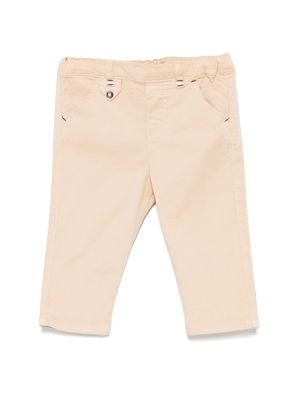Pantaloni per neonato Tartine Et Chocolat beige affusolati con due tasche laterali oblique