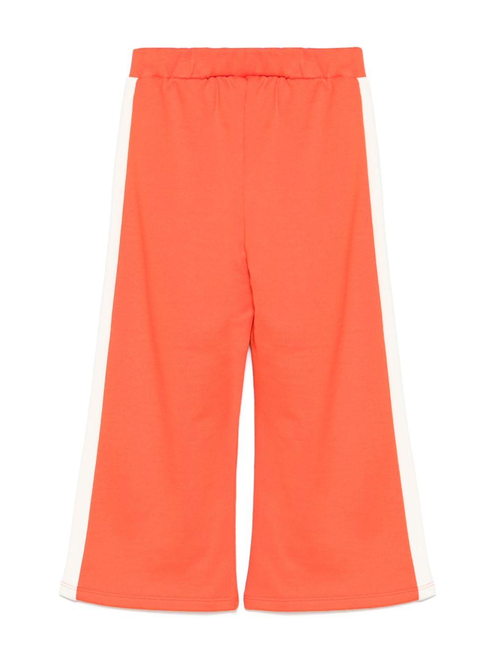 Pantaloni sportivi per bambina Mini Rodini Note rosso con dettaglio laterale a righe 2523011142 RED MINI RODINI 
