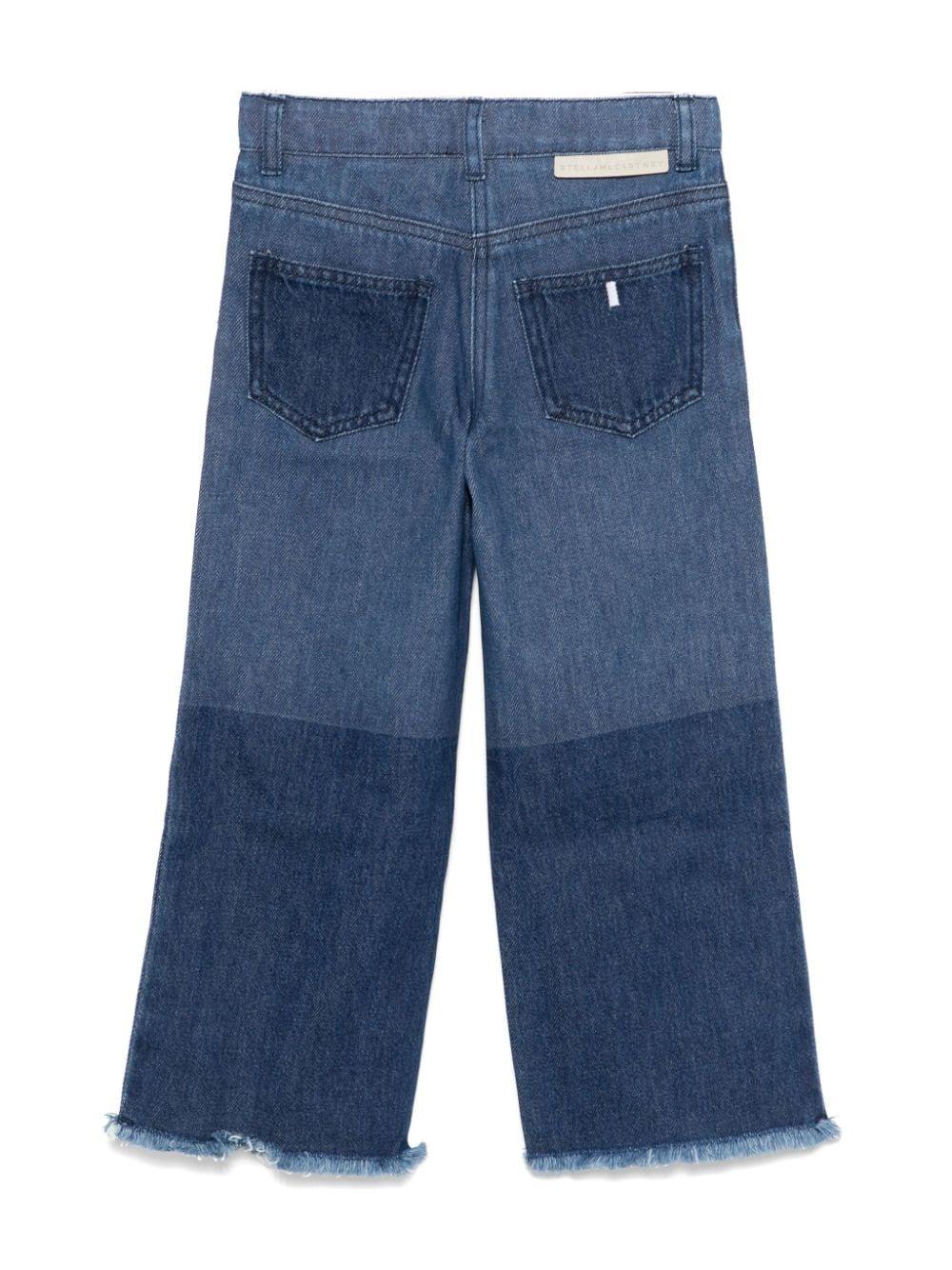 Jeans per bambina Stella McCartney Kids in denim blu con applicazione sul davanti - Rubino Kids