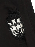 Jeans per bambino Amiri Kids nero con toppa con logo - Rubino Kids