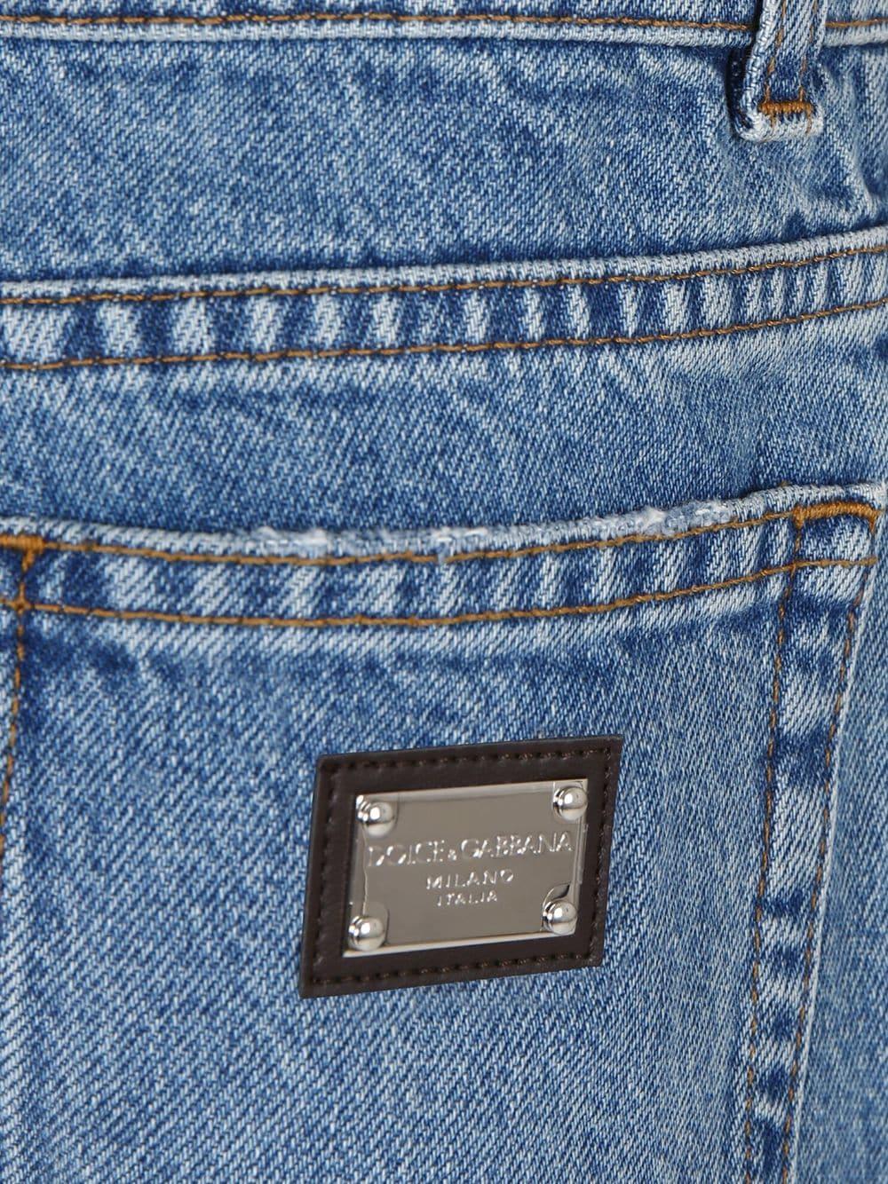 Jeans per bambino Dolce & Gabbana Kids in denim a gamba dritta con dettagli strappati - Rubino Kids