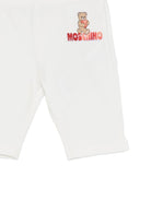 Leggins per neonata Moschino Kids bianchi con logo sul davanti - Rubino Kids