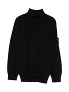 Maglione per bambino Stone Island Junior nero a collo alto con logo e toppa - Rubino Kids