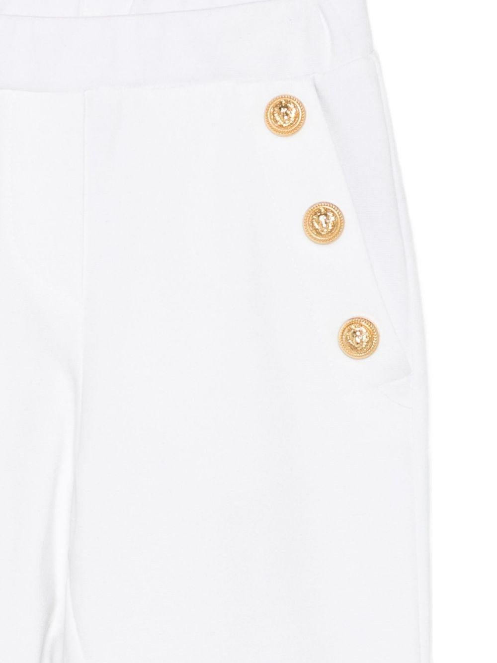 Pantaloni per bambina Balmain Kids bianchi con bottoni in oro - Rubino Kids