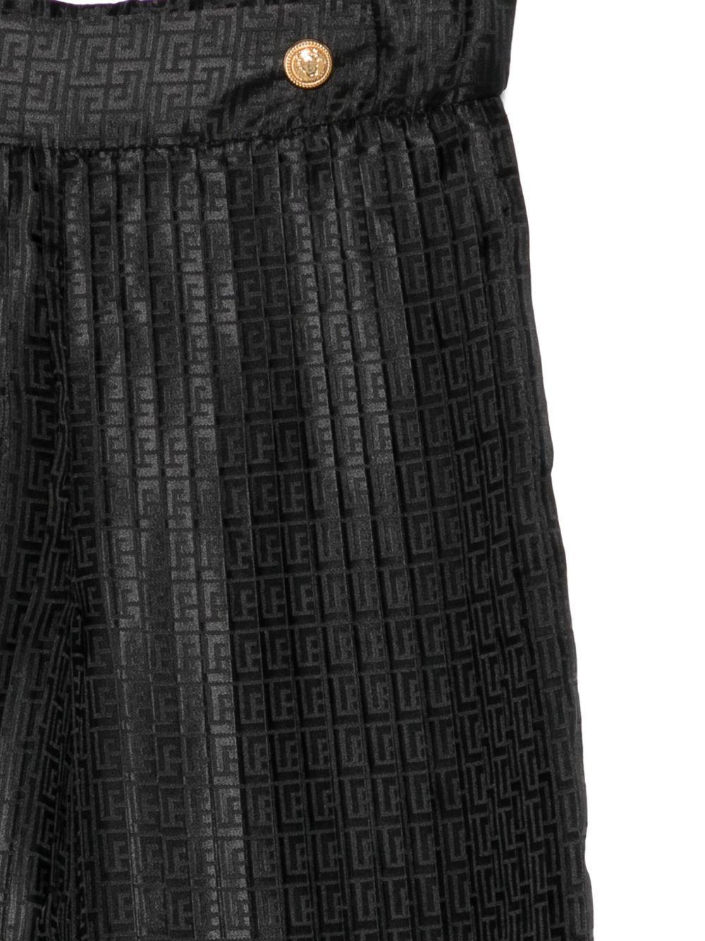 Pantaloni per bambina Balmain Kids neri con monogramma - Rubino Kids
