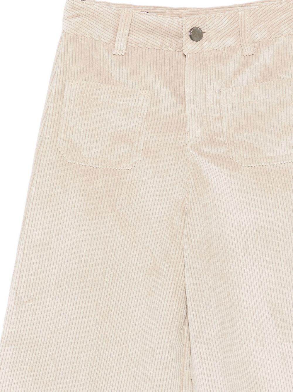 Pantaloni per bambina Emporio Armani Kids beige con dettaglio logo posteriore - Rubino Kids
