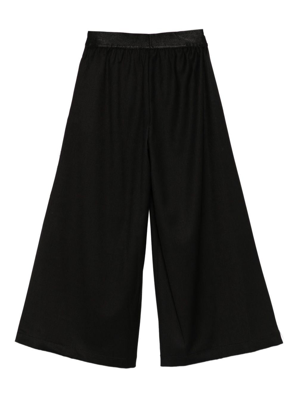 Pantaloni per bambina John Richmond Junior nero a gamba ampia con logo in vita - Rubino Kids