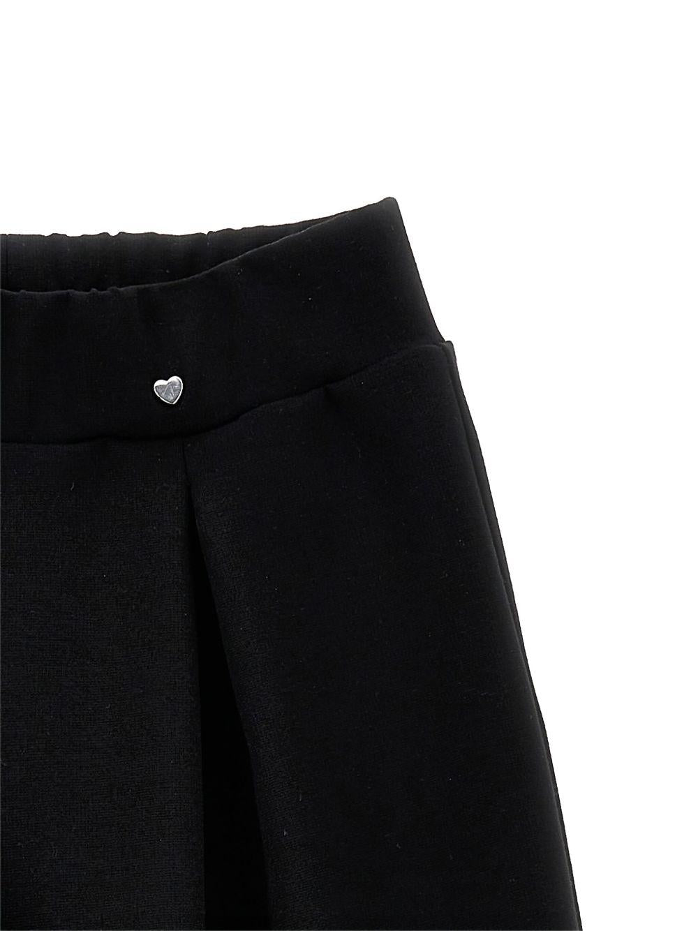 Pantaloni per bambina Monnalisa neri con dettagli plissettati - Rubino Kids