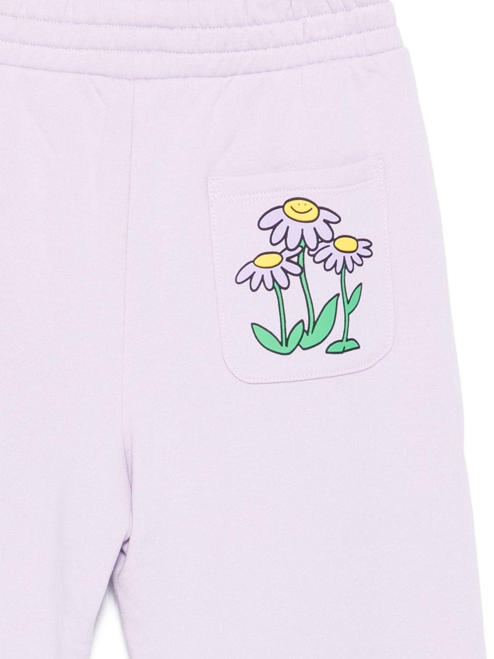 Pantaloni per bambina Stella McCartney Kids lilla con stampa margherite - Rubino Kids