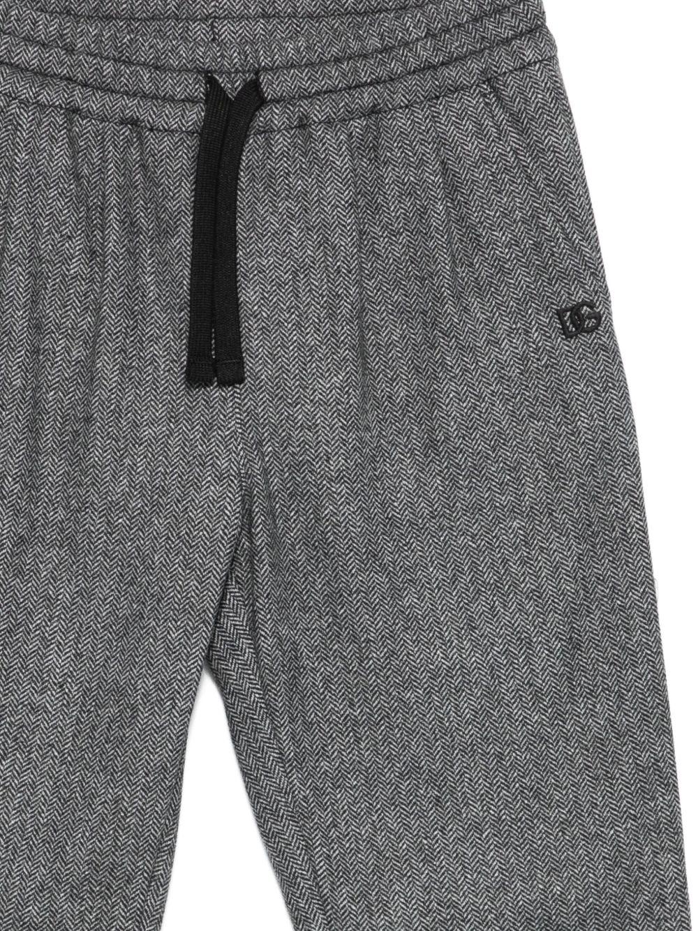 Pantaloni per bambino Dolce & Gabbana Kids grigi con scollo con cappuccio - Rubino Kids