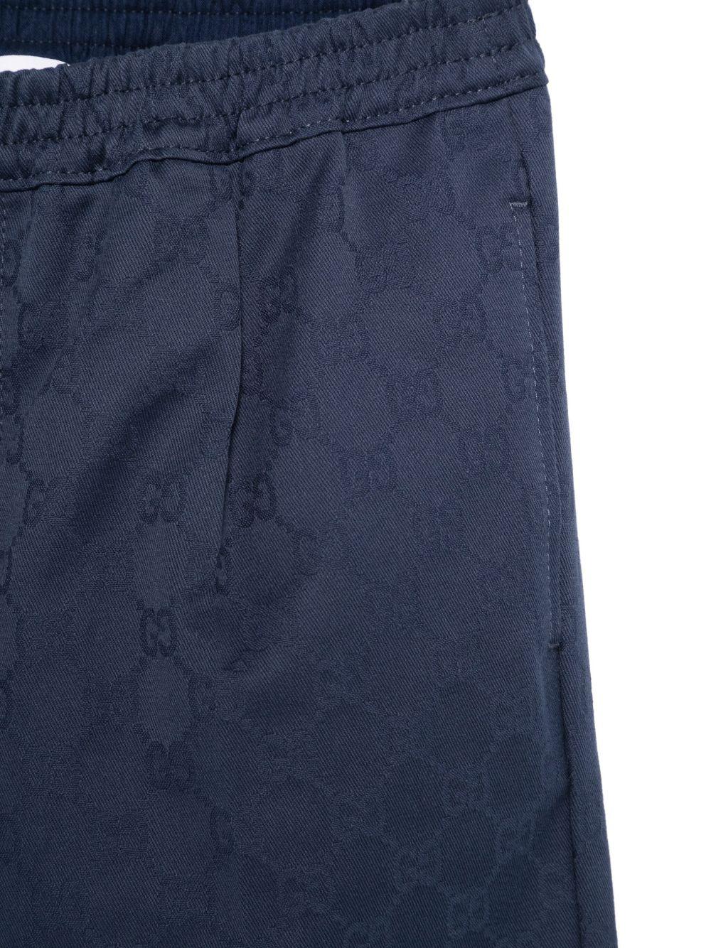 Pantaloni per bambino Gucci Kids blu con logo GG in cotone - Rubino Kids