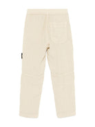 Pantaloni per bambino Stone Island Junior beige con applicazione Compass - Rubino Kids