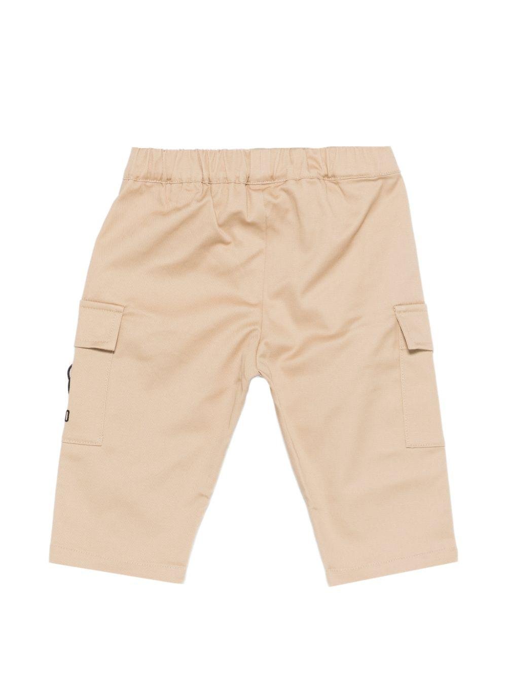 Pantaloni per neonato Moschino Kids beige con ricamo Teddy sul davanti - Rubino Kids