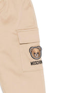 Pantaloni per neonato Moschino Kids beige con ricamo Teddy sul davanti - Rubino Kids
